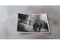Photo: Man, two women and a little girl in front of Shipka Monastery