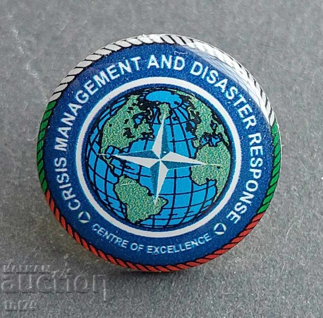 Badge: NATO. Crisis Management and Response Center Badge: NATO. Crisis Management and Response Center