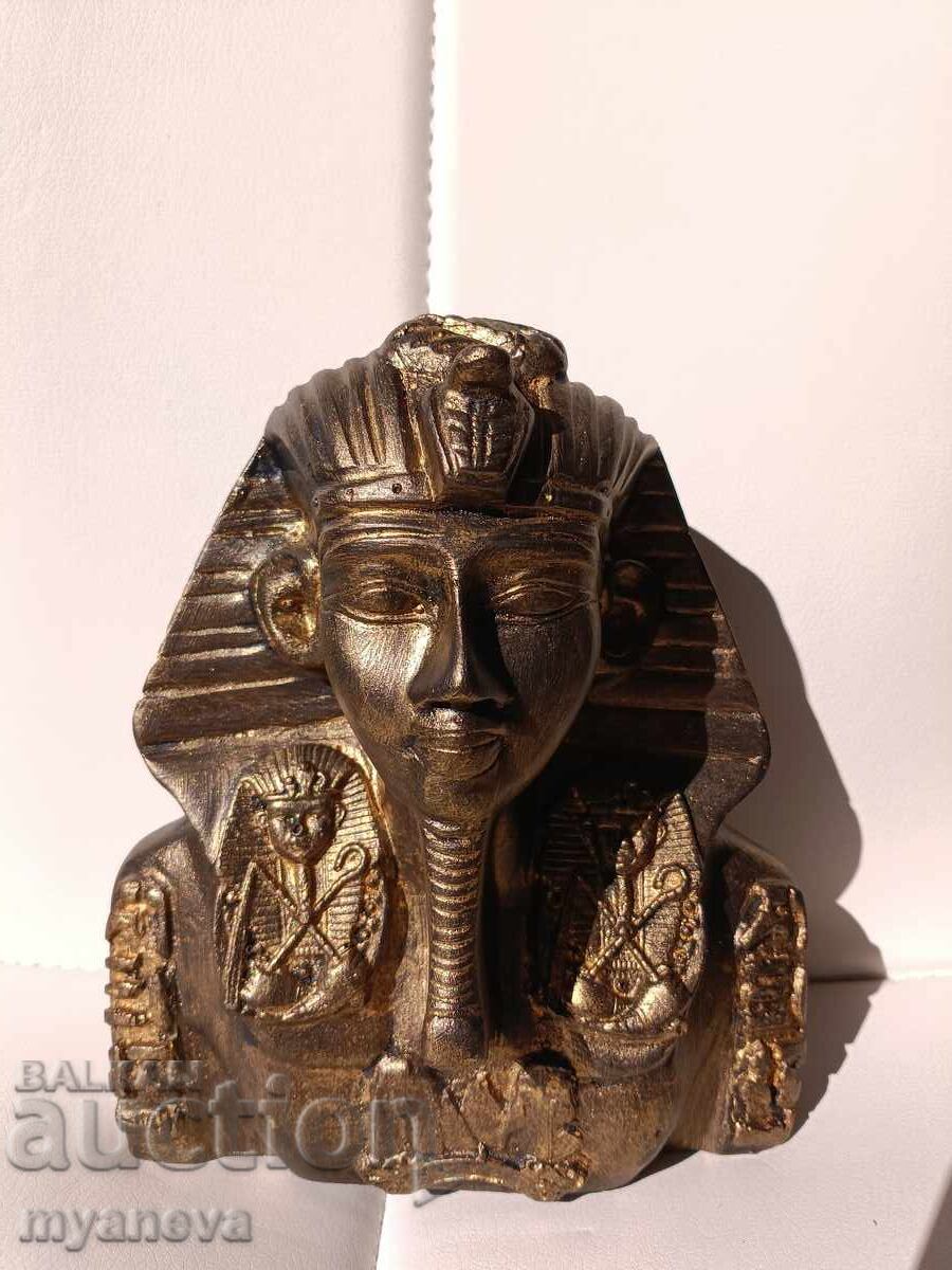 Delivery of Tutankhamun, Egyptian statuette with rich ornamentation