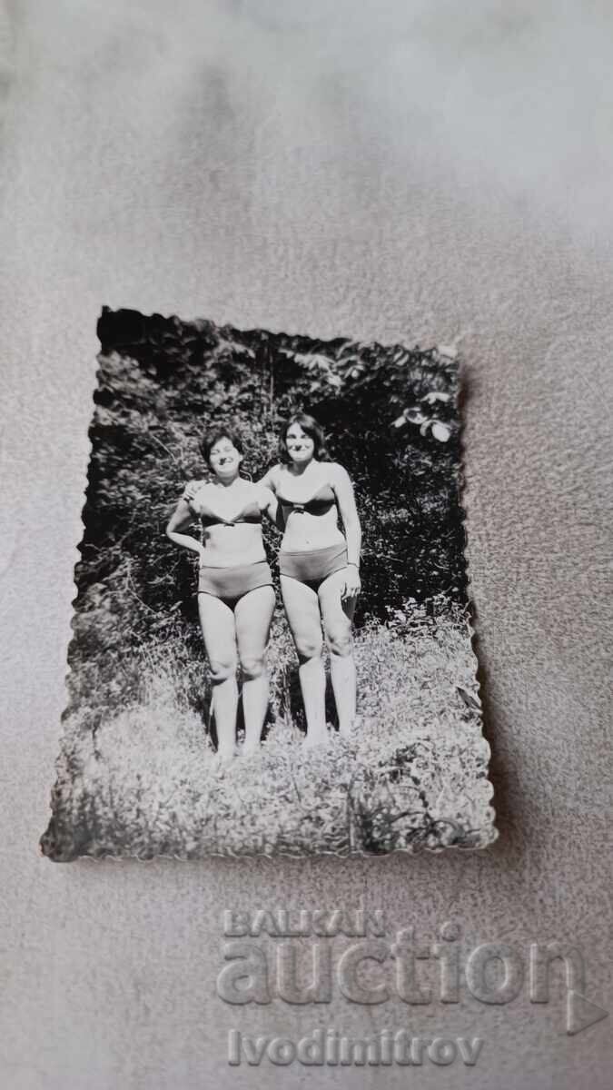 Photo of Two Women in Swimsuits on the Meadow Photo of Two Women in Swimsuits on the Meadow