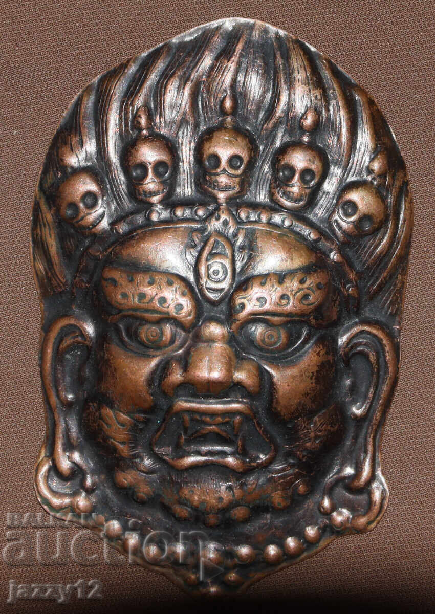 Delivery of Small Copper Mask Amulet Nepal
