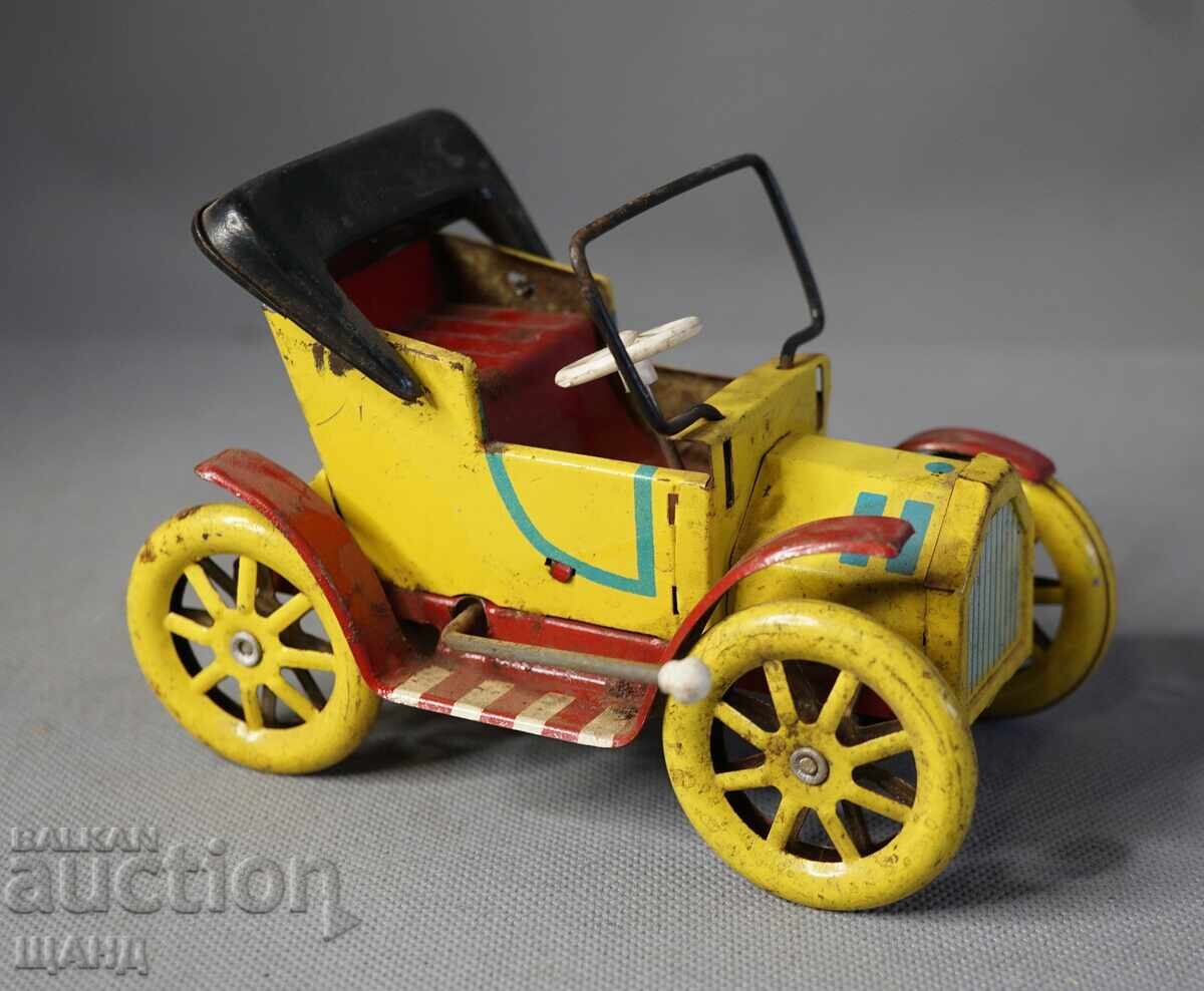 Παλιό μεταλλικό μηχανικό παιχνίδι ρετρό αυτοκίνητο μοντέλο