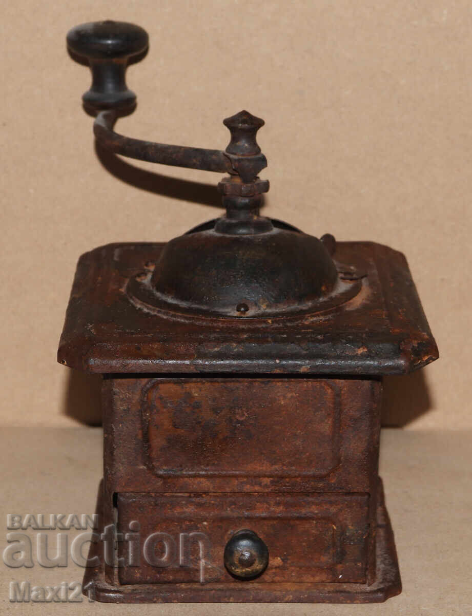 Antique hand-crank metal coffee grinder