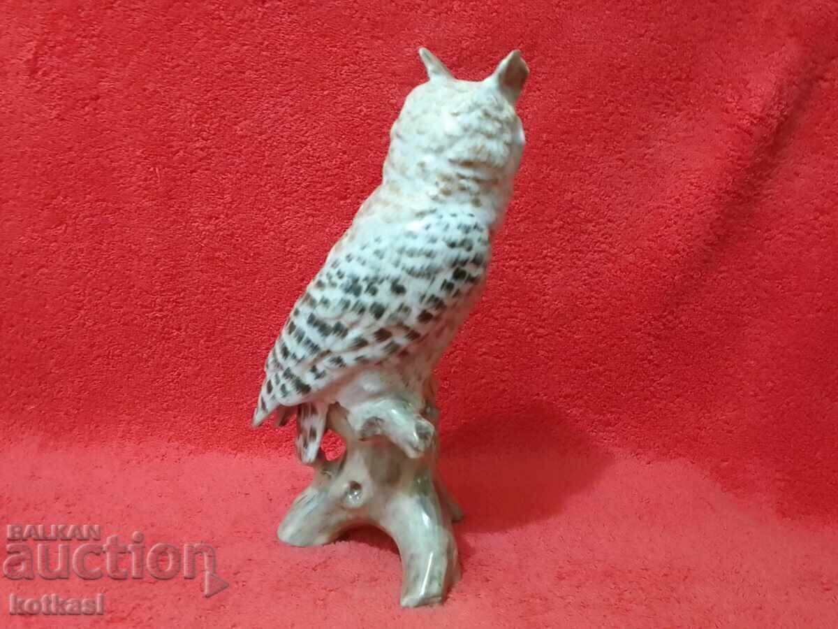 Auction Colorful porcelain owl figure on a branch Auction Colorful porcelain owl figure on a branch