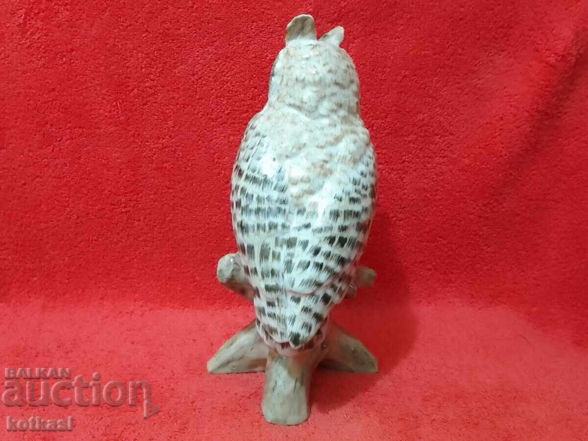 Delivery of Colorful porcelain owl figure on a branch Delivery of Colorful porcelain owl figure on a branch