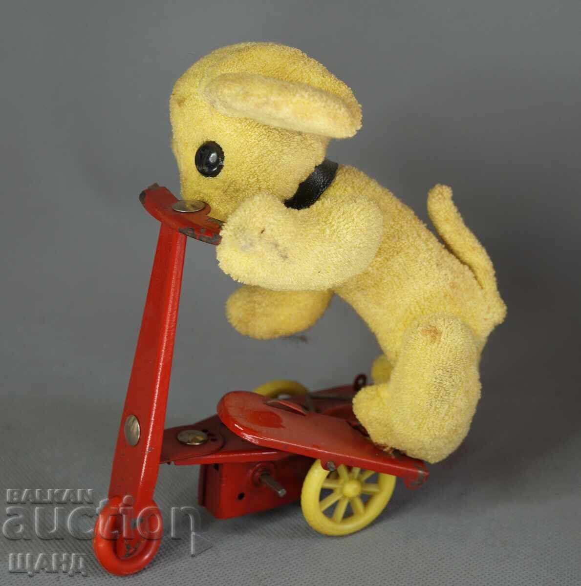 Old mechanical metal toy scooter model with dog with price 15.35 BGN | € 7.85