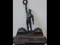 Old inkwell with a figure, statuette, figurine