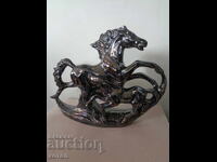 I am selling a porcelain composition of horses