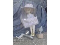 The little beekeeper with beekeeping equipment