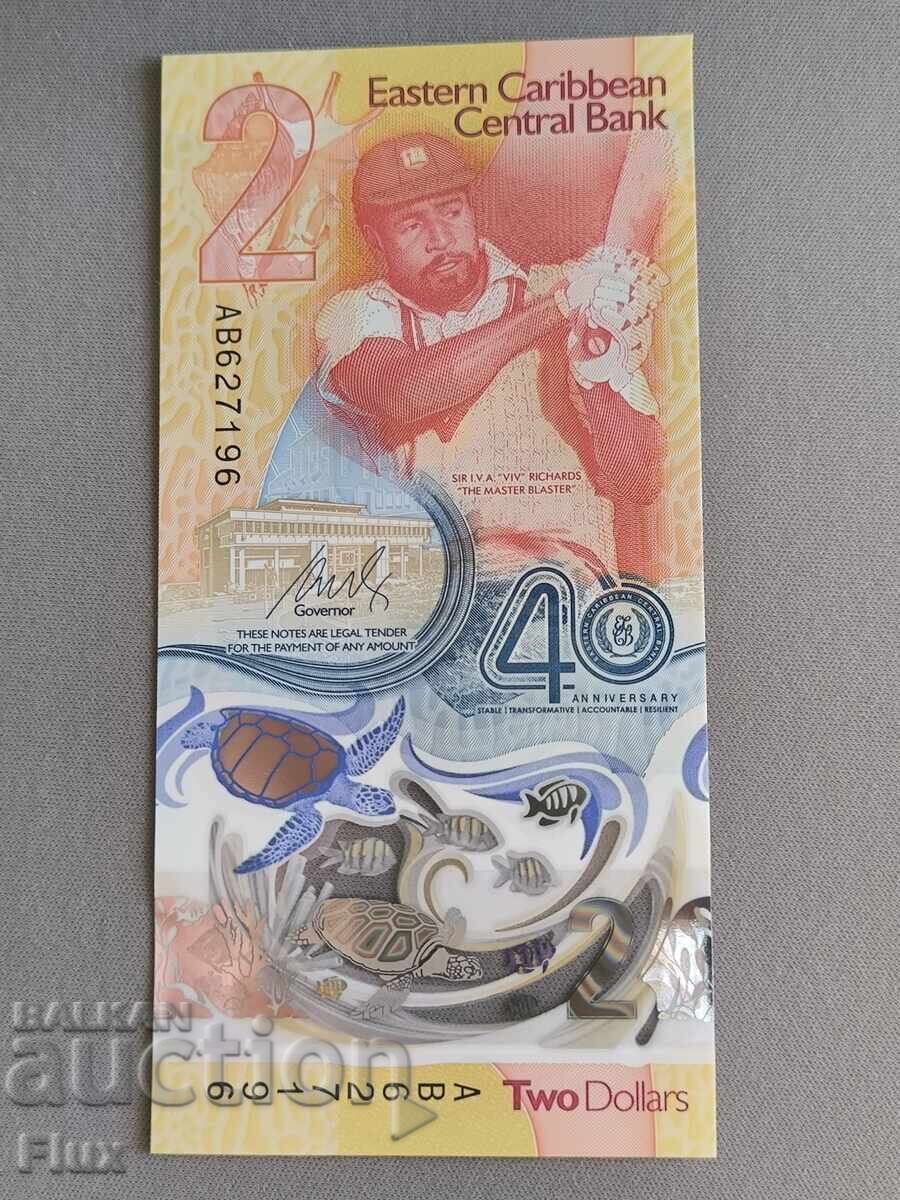 Банкнота - Източни Кариби - 2 долара (юбилейна) UNC | 2023г. с цена 14.00 лв. | € 7.16
