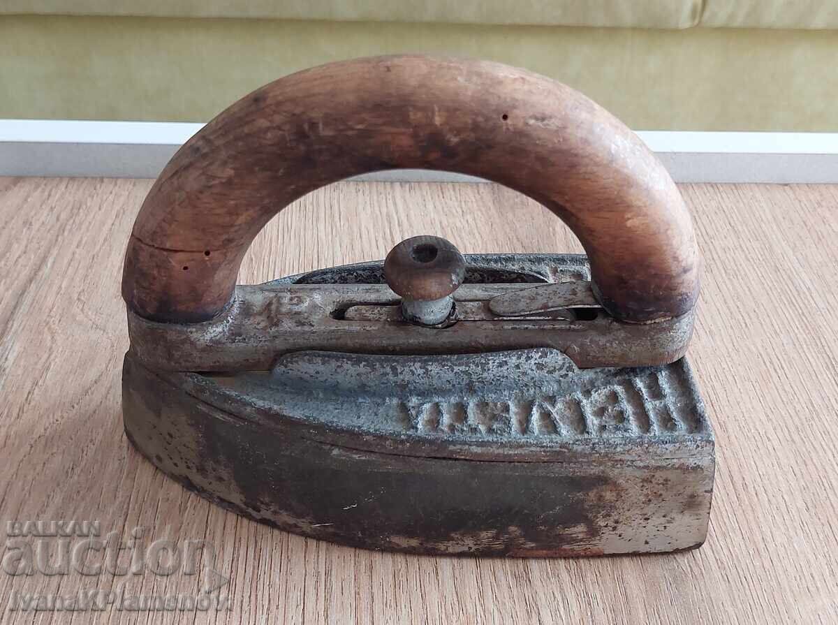 Vintage iron with a handle locking mechanism Vintage iron with a handle locking mechanism