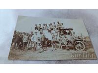 Officers and soldiers with a retro car at the front WWI