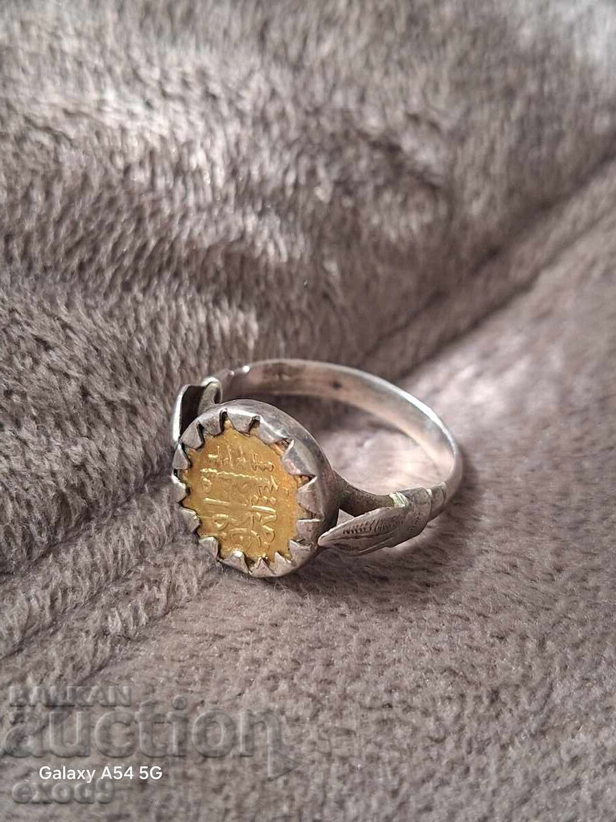 Antique silver ring with a gold coin Antique silver ring with a gold coin