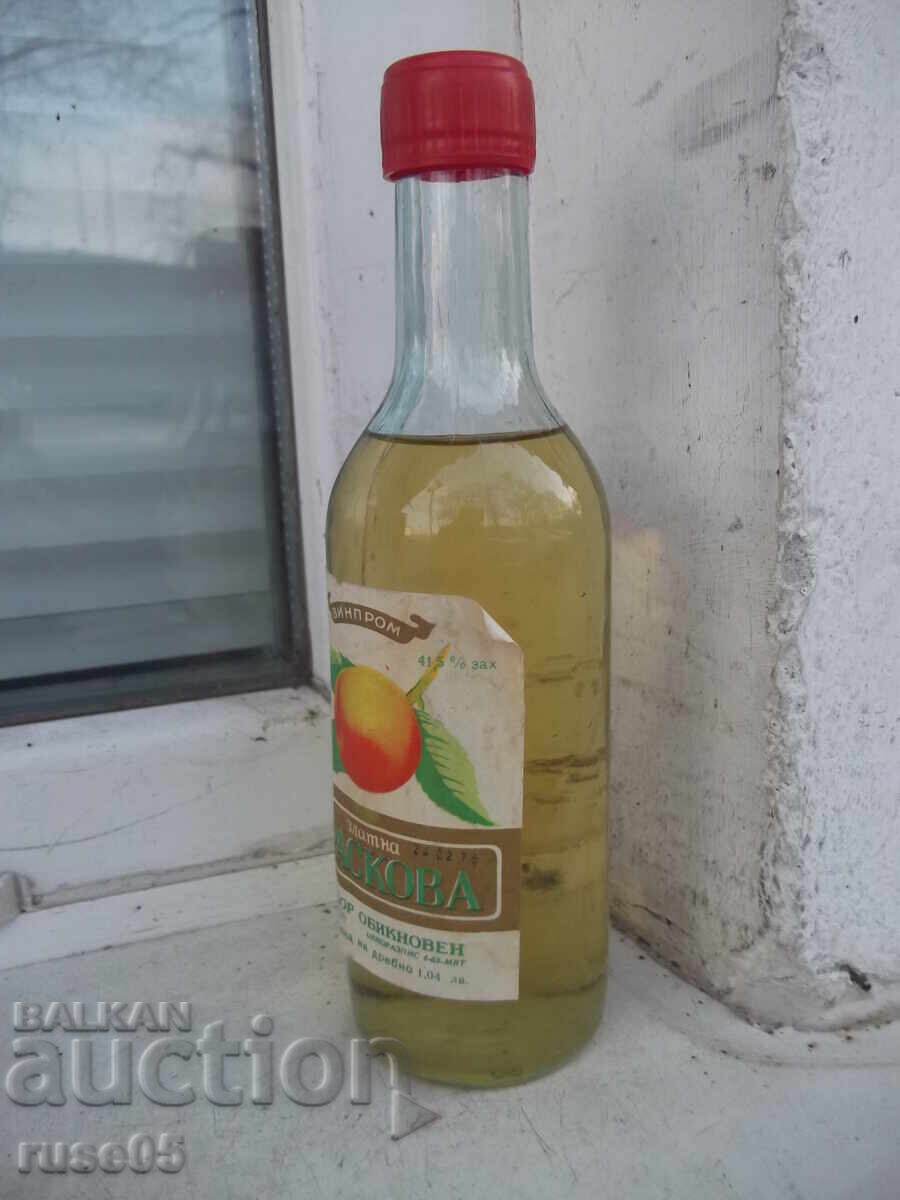 Auction  Liqueur "Golden peach" from the time of the soca unopened