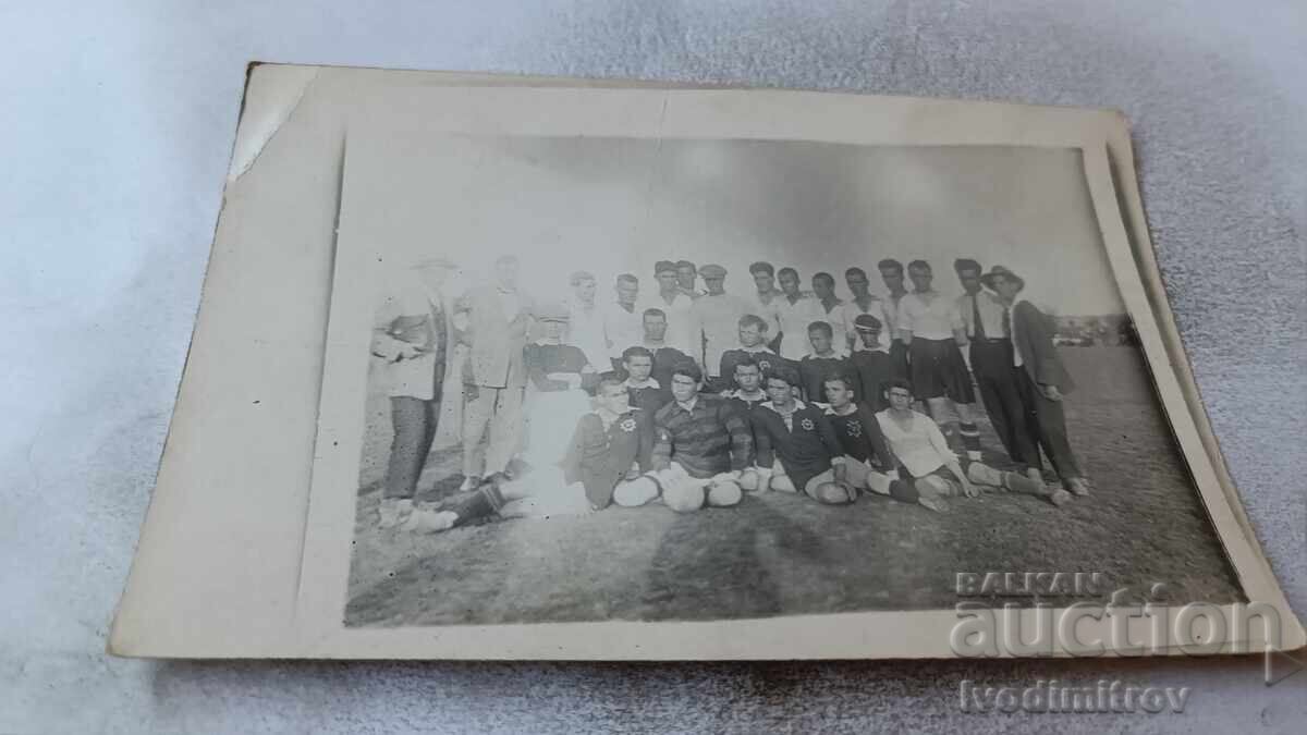 Photo Football players with their managers Photo Football players with their managers