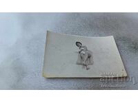 Fotografie Femeie pe saltea la plajă