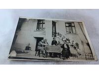 Photo Sofia The whole family around a table in the yard of their house