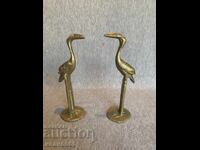 Old brass bird figurines: stork, crane