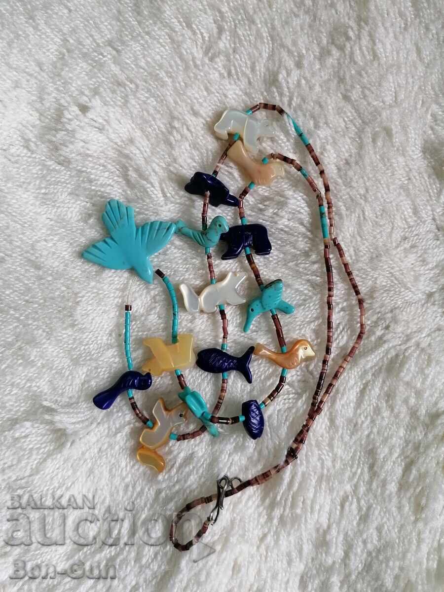 Auction  Mother-of-pearl necklace, semi-precious stones, etc