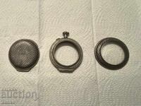 Parts of a silver pocket watch