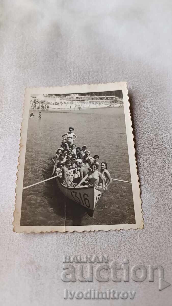 Photo of Women and Children with a Boat for Sea Excursions
