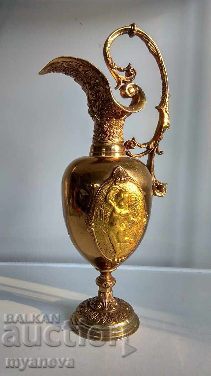 Bronze, massive jug with ornaments from mythology with price 120.00 BGN | € 61.36