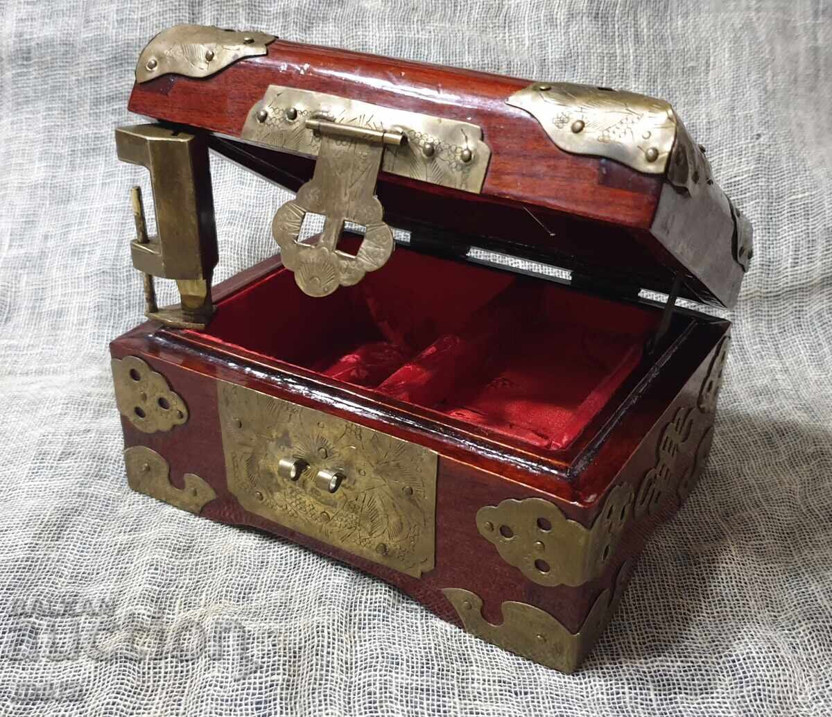 Delivery of Beautiful jewelry box made of exotic wood and rich hardware
