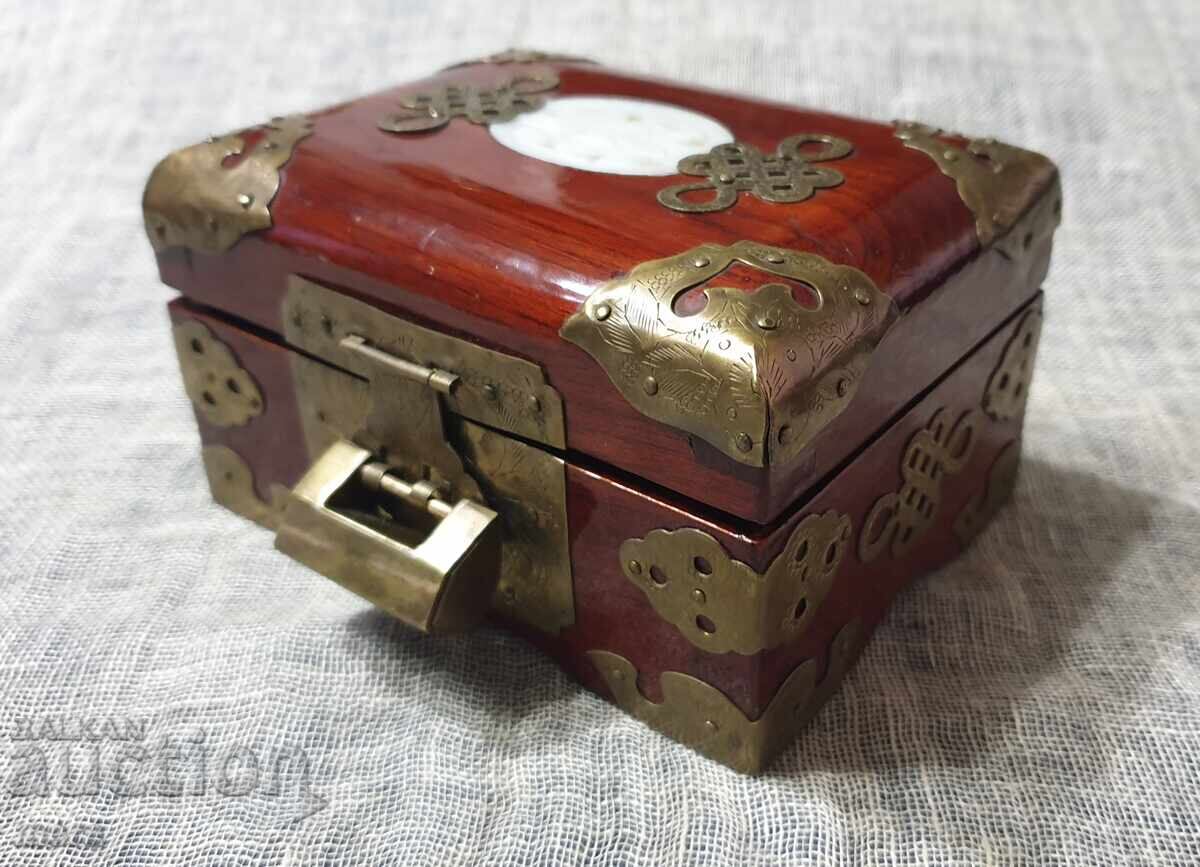 Beautiful jewelry box made of exotic wood and rich hardware