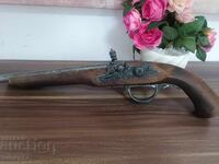Exceptionally good replica of an old flintlock pistol. Has