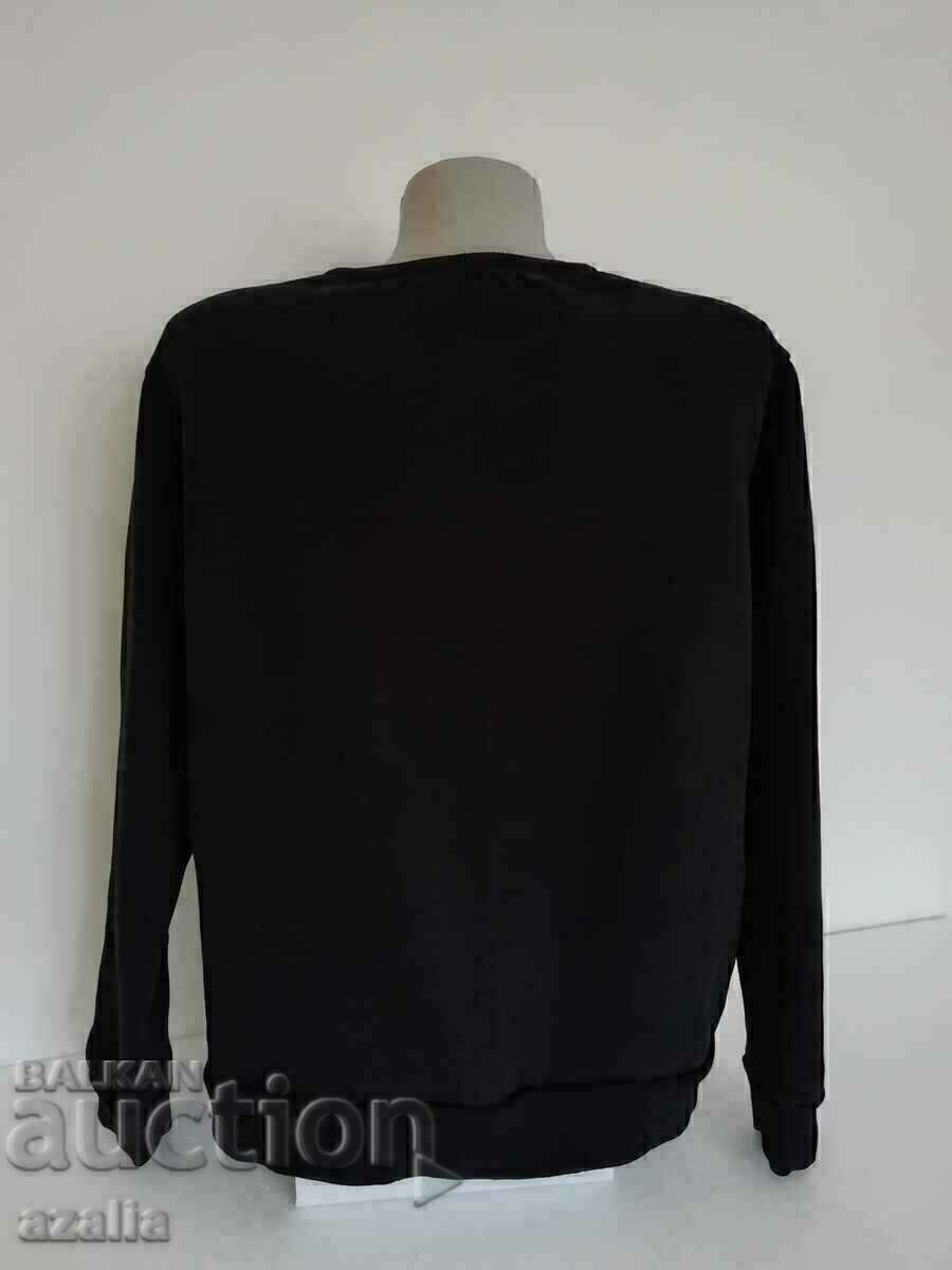 Auction  Black quilted blouse with two flower ornaments, size M