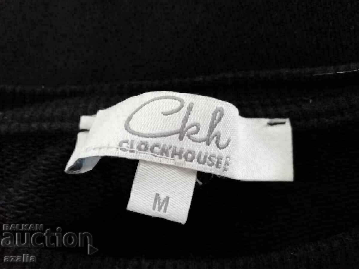 Delivery of Black quilted blouse with two flower ornaments, size M