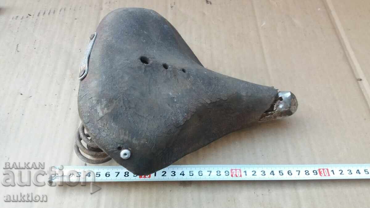 OLD SOCIALIST BIKE SEAT, WHEEL OLD SOCIALIST BIKE SEAT, WHEEL