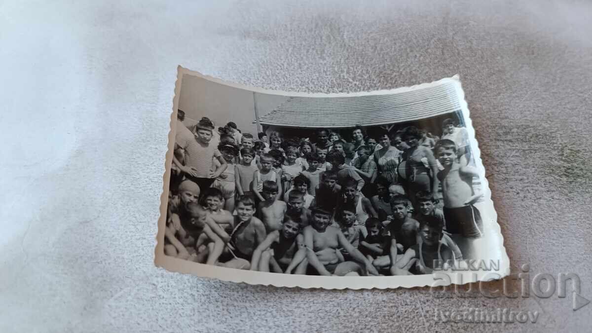 Photo Women and children on the beach Photo Women and children on the beach