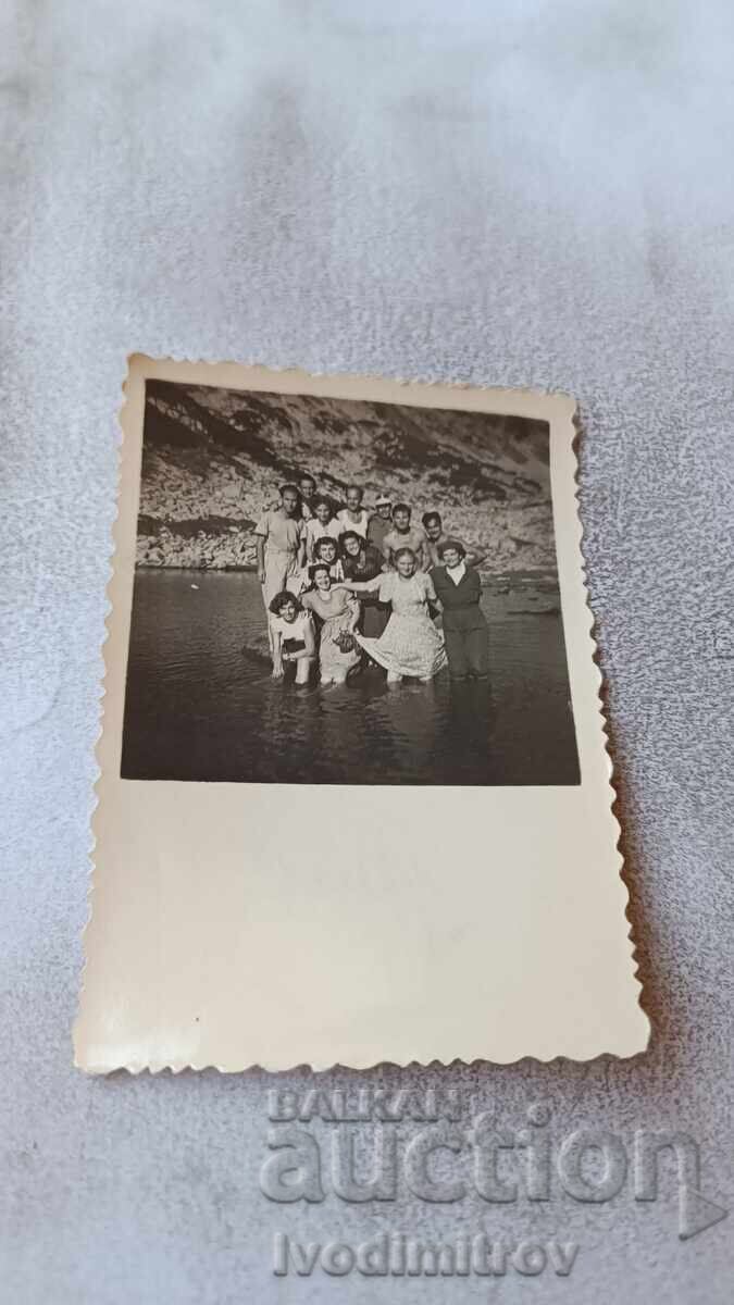 Photo of Pirin: Young men and women at one of the Banderishki Lakes