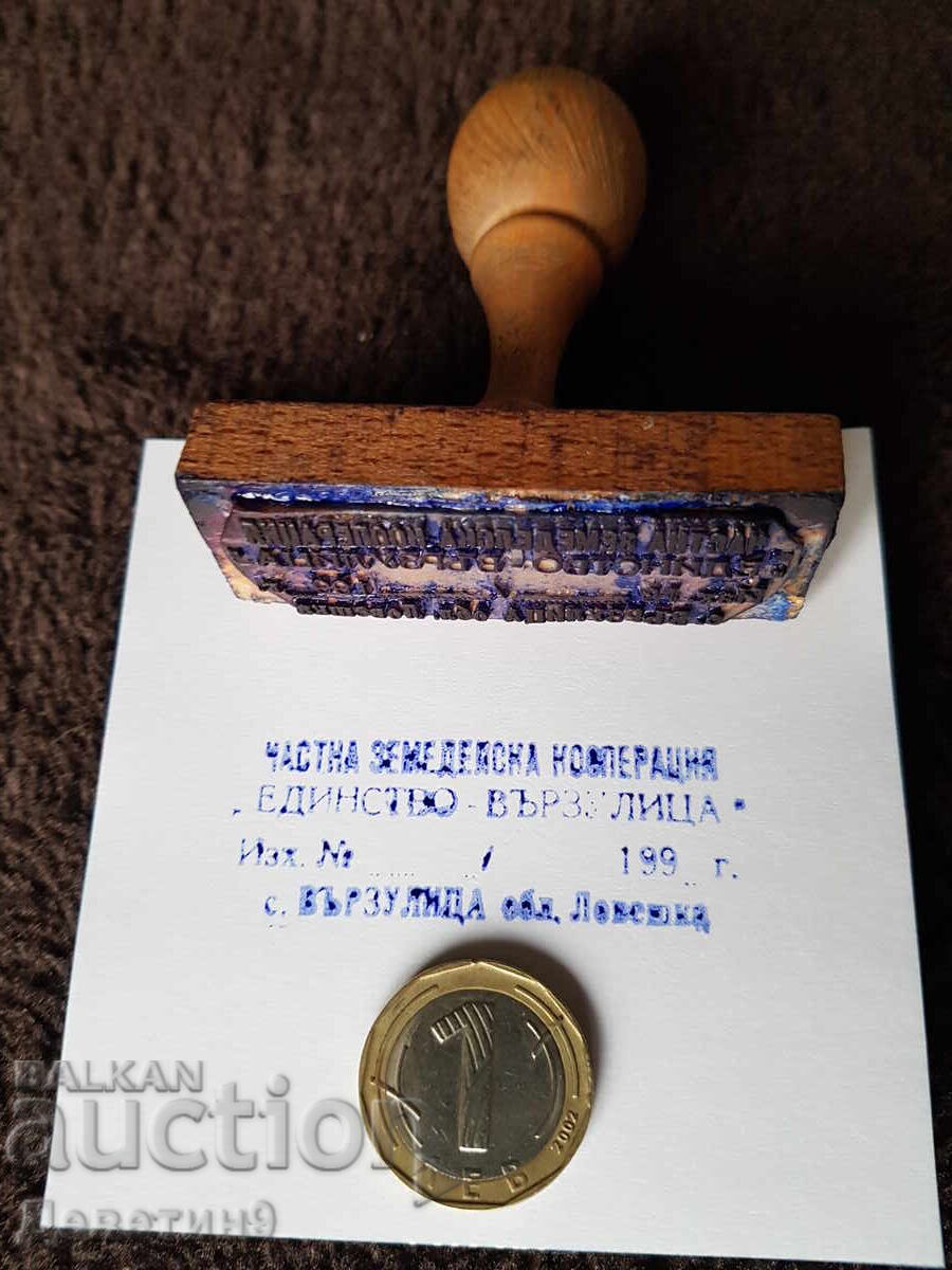 Old wet stamp with a wooden handle