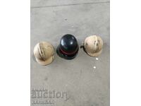 THREE OLD HELMETS, ONE IS GERMAN