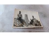 Photo: Two men on rocks in front of Shipka Monument