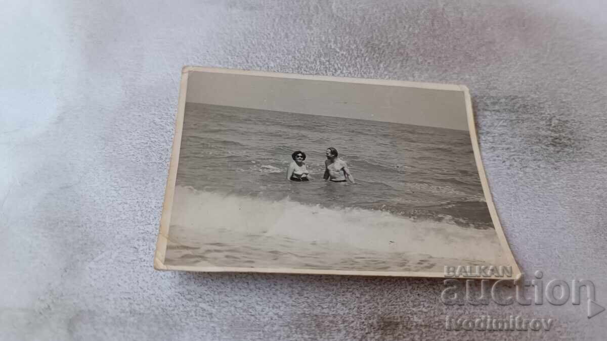 Photo of a Man and Woman in the Sea