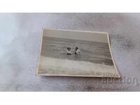 Photo of a Man and Woman in the Sea