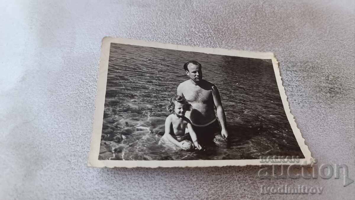 Picture of a Man and a Little Girl in the Sea