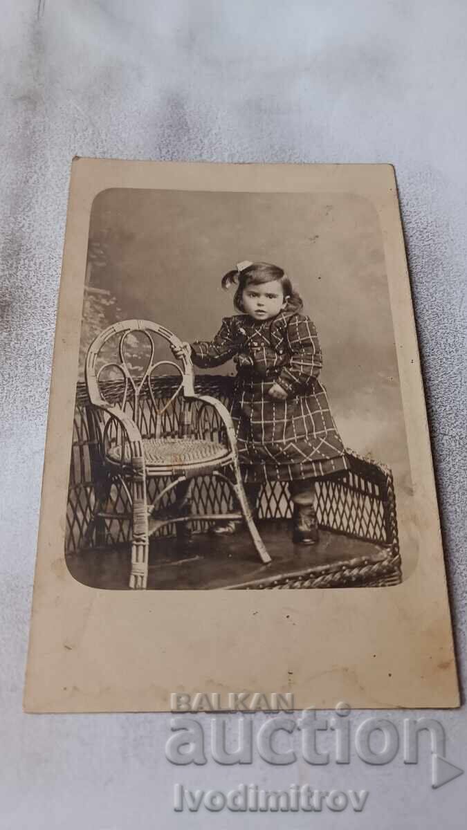 Photo of a Little Girl on a Knitted Bench Photo of a Little Girl on a Knitted Bench