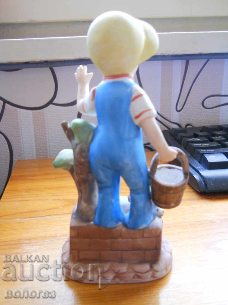 Auction  Boy with a puppy - biscuit porcelain