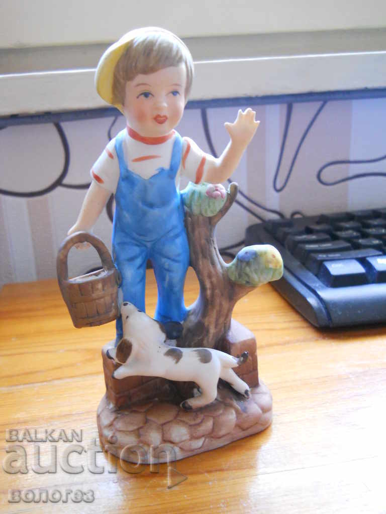 Boy with a puppy - biscuit porcelain