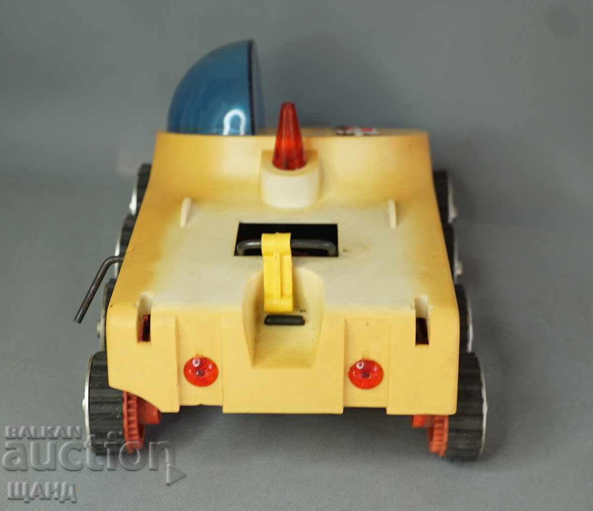 Delivery of Old Russian plastic toy model Lunokhod (moon rover) on batteries