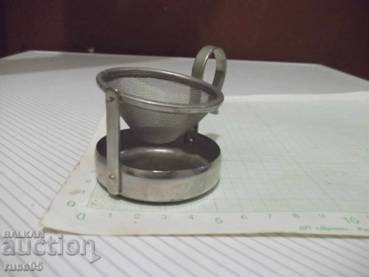 Auction  Tea strainer swing