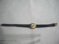 Old ladies gold watch.