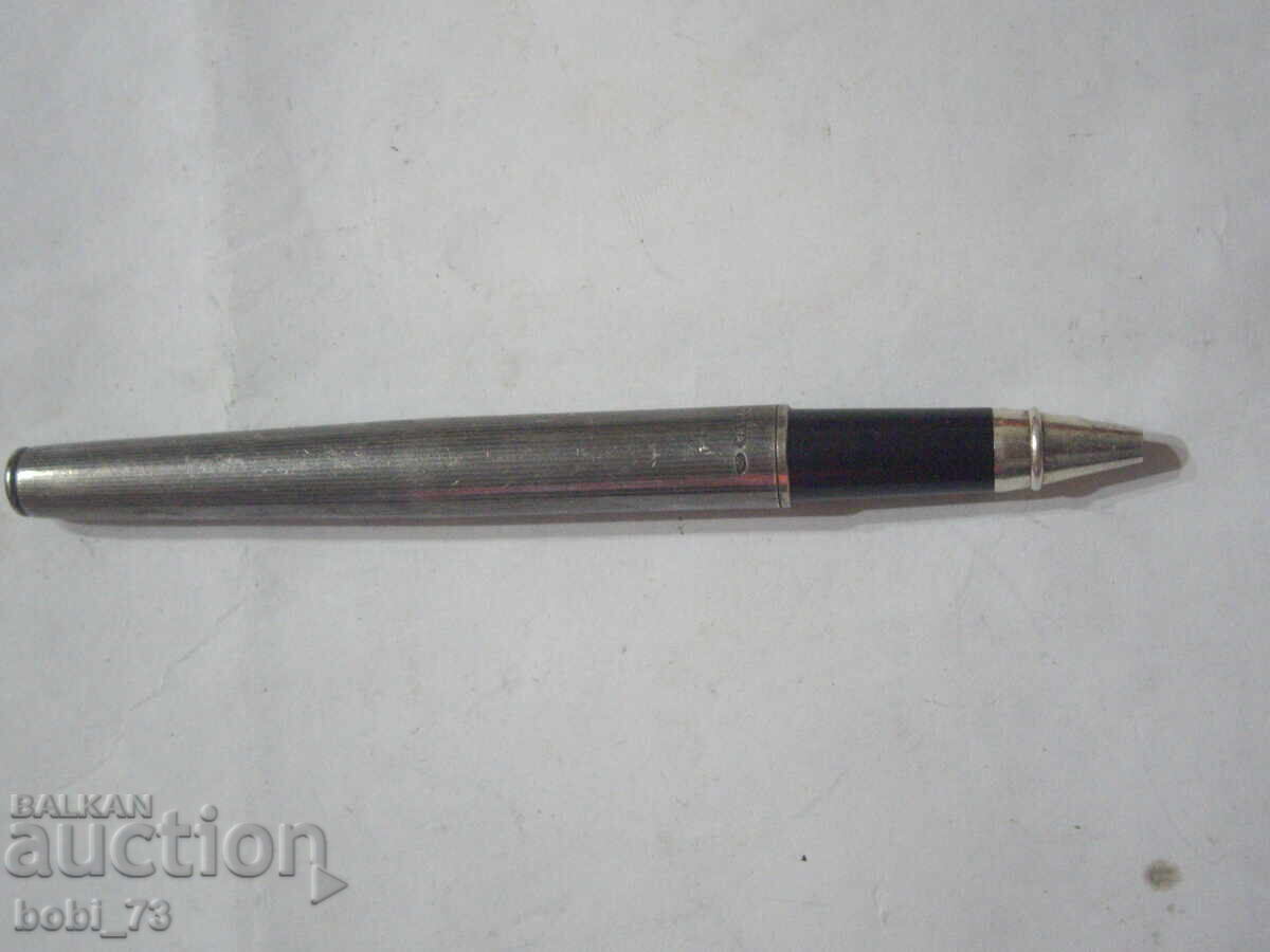 An old silver pen. An old silver pen.
