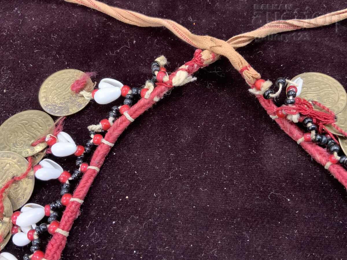 Delivery of Revival-era necklace with snowdrop shells, beads, and coins