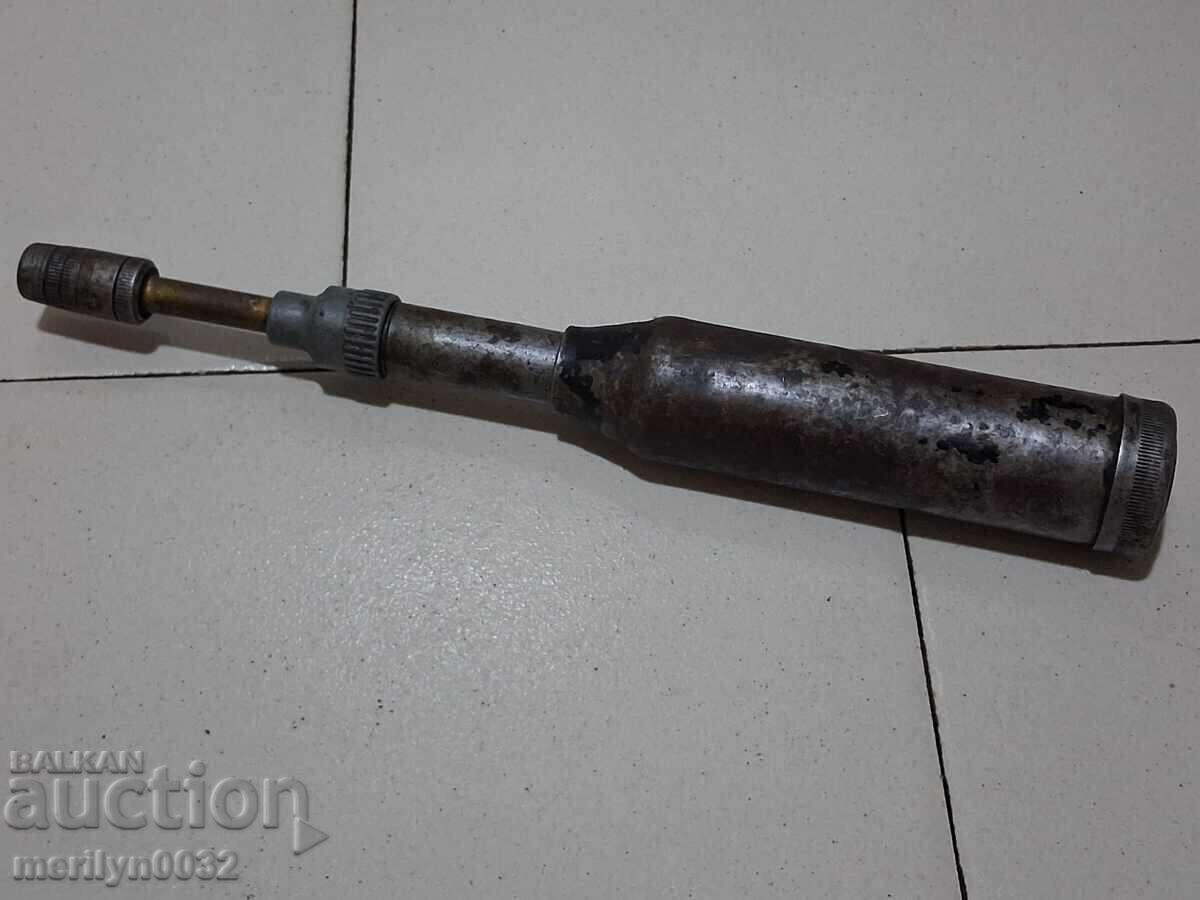 Auction  Old-fashioned grease fitting from an army engine, motorcycle grease gun