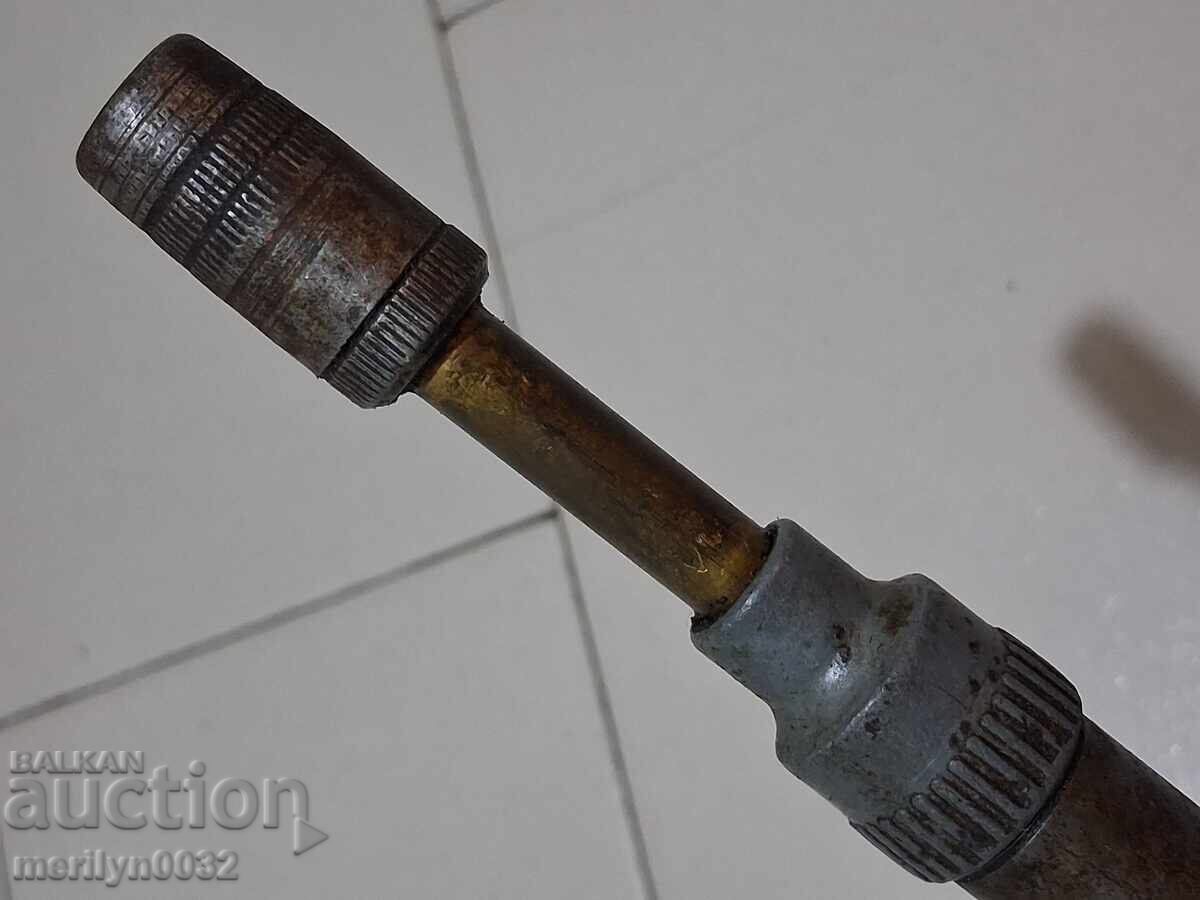 Delivery of Old-fashioned grease fitting from an army engine, motorcycle grease gun